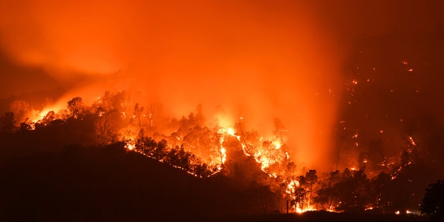 Smoke billows into the sky as the Glass Fire burns in the hills of Calistoga, Calif., on Monday, Sept. 28, 2020.