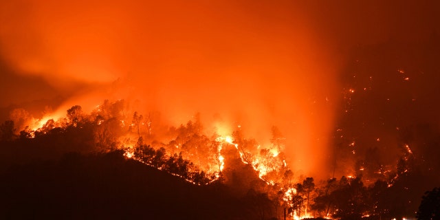 Smoke billows into the sky as the Glass Fire burns in the hills of Calistoga, Calif., on Monday, Sept. 28, 2020.