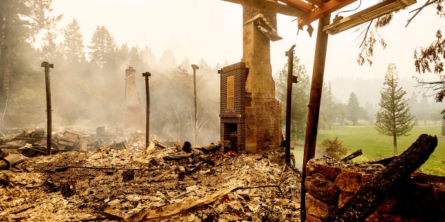 A chimney stands, Monday, Sept. 28, 2020, at the Restaurant at Meadowood, which burned in the Glass Fire, in St. Helena, Calif.