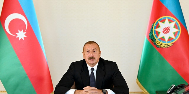 In this photo provided by Azerbaijan's Presidential Press Office provided on Sunday, Sept. 27, 2020, Azerbaijani President Ilham Aliyev addresses the nation in Baku, Azerbaijan.