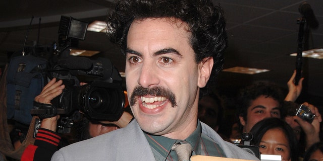 Sacha Baron Cohen as his fictional character Borat. 