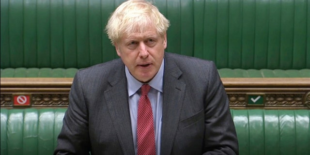 British Prime Minister Boris Johnson, shown here speaking in the House of Commons on Tuesday, has announced new coronavirus prevention measures. (AP/House of Commons)