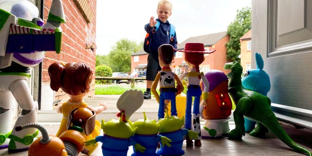 Vinny Donnelly, age 4, was all smiles while waving goodbye to his action figures from the Disney Pixar flicks.