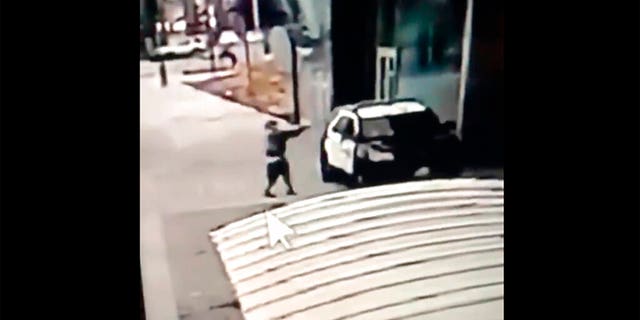 A screen grab from a security camera video released the Los Angeles County Sheriff's Department shows a gunman walking up to sheriff's deputies and opening fire without warning or provocation in Compton, Calif., on Saturday, Sept. 12, 2020. Officials say two Los Angeles County sheriff's deputies were shot in their patrol car at a Metro rail station in what appeared to be an ambush. The sheriff's department said the male and female deputies were shot in the head and had multiple gunshot wounds and were undergoing surgery. Deputies were searching for a suspect. (Los Angeles County Sheriff's Department via AP)