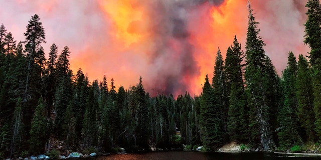 Smoke from the Creek Fire wells behind a ridge by Huntington Lake on Saturday, September 5, 2020 in Huntington Lake, California.