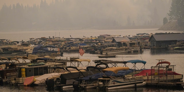 Smoke from the Creek Fire fills the air over a marina, Monday, Sept. 7, 2020, in Shaver Lake, California.