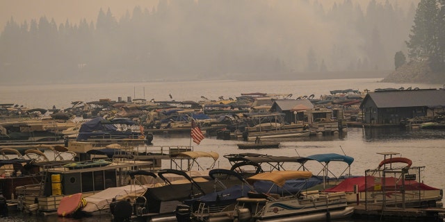 Smoke from the Creek Fire fills the air over a marina, Monday, Sept. 7, 2020, in Shaver Lake, Calif.
