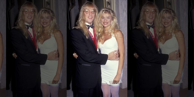 Jani Lane and Bobbie Brown attend BMI Awards Gala on May 21, 1991, at the Beverly Wilshire Hotel in Beverly Hills, California.