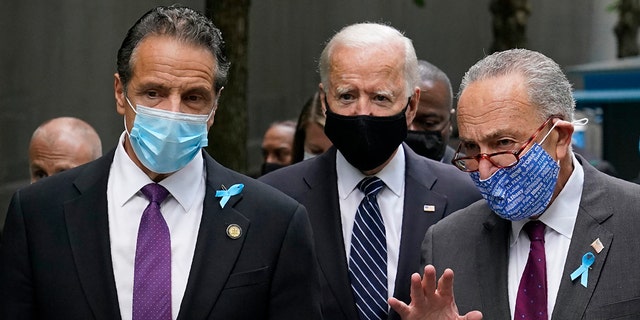 Democratic presidential candidate and former Vice President Joe Biden, center, walks with New York Gov. Andrew Cuomo, left, and Senate Minority Leader Sen. Chuck Schumer of N.Y., after arriving at the National September 11 Memorial in New York, Friday, Sept. 11, 2020, for a ceremony marking the 19th anniversary of the Sept. 11 terrorist attacks. (AP Photo/Patrick Semansky)
