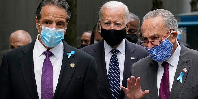 Democratic presidential candidate and former Vice President Joe Biden, center, walks with New York Gov. Andrew Cuomo, left, and Senate Minority Leader Sen. Chuck Schumer of N.Y., after arriving at the National September 11 Memorial in New York, Friday, Sept. 11, 2020, for a ceremony marking the 19th anniversary of the Sept. 11 terrorist attacks. (AP Photo/Patrick Semansky)