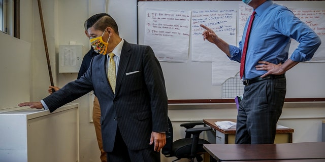 NYC School Chancellor Richard Carranza, left, and Mayor Bill de Blasio on Aug. 26 during an inspection of health safeguard protocols for COVID-19 at Bronx Collaborative High School in New York. (AP)