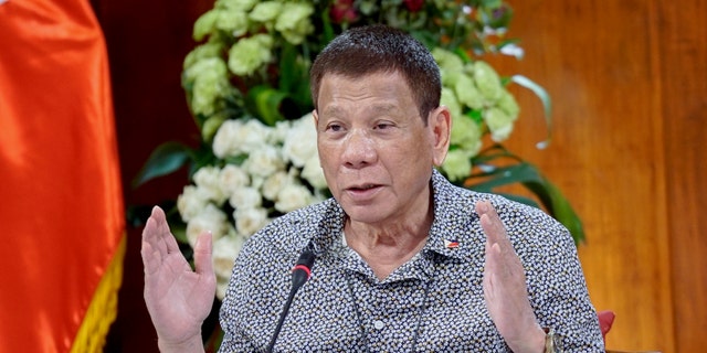 Philippine President Rodrigo Duterte gestures as he meets members of the Inter-Agency Task Force on the Emerging Infectious Diseases at the Malacanang presidential palace in Manila, Philippines on Monday. (AP/Malacanang Presidential Photographers Division)