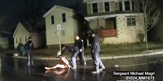 In this image taken from police body camera video provided by Roth and Roth LLP on Sept. 2, 2020, a Rochester police officer puts a hood over the head of Daniel Prude, on March 23, 2020, in Rochester, N.Y. (Rochester Police via Roth and Roth LLP via AP)