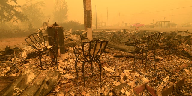 Three chairs are all that remain at the Gates post office in Gates, Ore., Wednesday, Sept 9, 2020. (Associated Press)