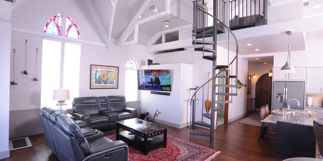 The one-of-a-kind watercraft was once a wedding chapel, and has since been converted into an open concept, two-bedroom houseboat.