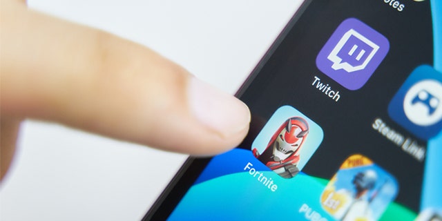 Bishkek, Kyrgyzstan - July 6, 2019: Fortnite app on game smartphone. close-up on iPhone screen.