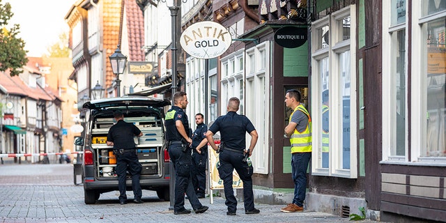 Sept. 14, 2020, Lower Saxony, Celle: Police task forces are securing a crime scene in the city centre. This afternoon, two armed men attempted to rob a jewelry store One of the perpetrators was killed, the other seriously injured. (Photo by Moritz Frankenberg/picture alliance via Getty Images)