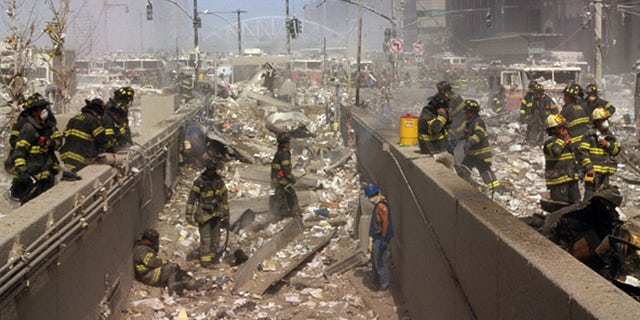 New York firefighters in 2001 amid the rubble of the World Trade Center following the 9/11 attacks (Universal History Archive/Universal Images Group via Getty Images)