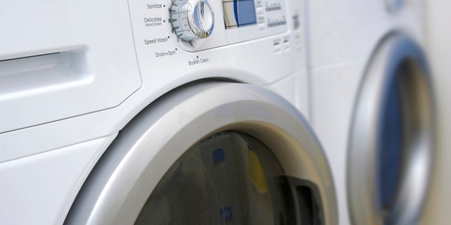 A photo of a modern front-loading clothes washer and dryer.