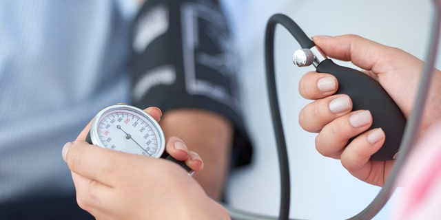 A nurse measures a patient's blood pressure. "Patients are at risk for high blood pressure, also known as hypertension, when their systolic blood pressure readings are consistently between 120 and 129, which is called elevated blood pressure." said one medical expert.