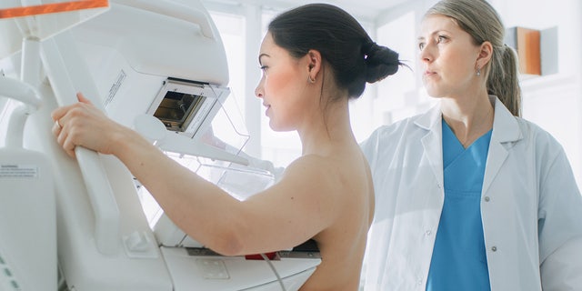 A woman is shown getting a mammogram. Some women also need to have a breast ultrasound, which provides more information to doctors. 