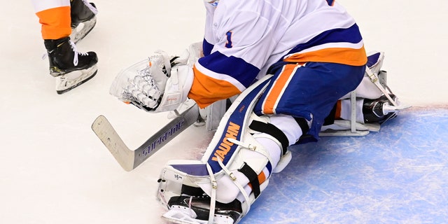 New York Islanders goaltender Thomas Greiss (1) makes a save against the Philadelphia Flyers during second-period NHL Stanley Cup Eastern Conference playoff hockey game action in Toronto, Saturday, Sept. 5, 2020. (Frank Gunn/The Canadian Press via AP)
