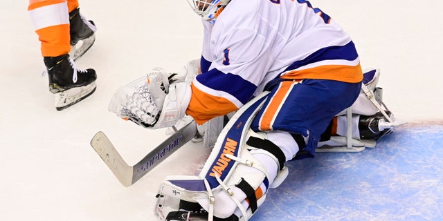 New York Islanders goaltender Thomas Greiss (1) makes a save against the Philadelphia Flyers during second-period NHL Stanley Cup Eastern Conference playoff hockey game action in Toronto, Saturday, Sept. 5, 2020. (Frank Gunn/The Canadian Press via AP)