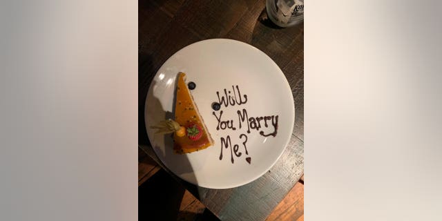 Durand's friend called the restaurant, pretending to be Durand, and said he was planning on proposing to the woman he was with.