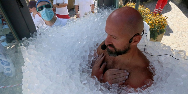 Austrian Josef Koeberl submerged himself in ice for 2.5 hours Saturday in Melk, Austria. (AP)