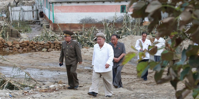 In this Saturday, Sept. 5, 2020, photo provided by the North Korean government, North Korea leader Kim Jong Un visits a damaged area in the South Hamgyong province, North Korea, following a typhoon known as Maysak.