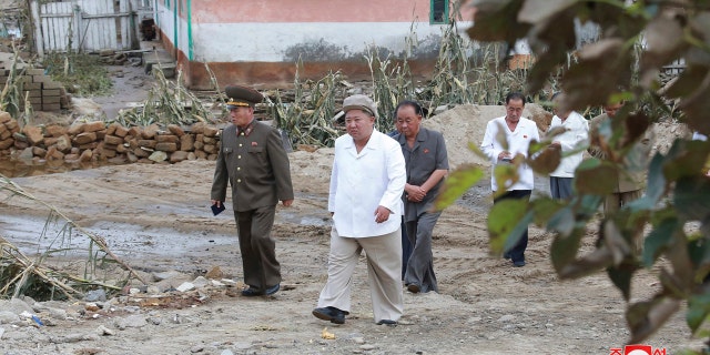 In this Saturday, Sept. 5, 2020, photo provided by the North Korean government, North Korea leader Kim Jong Un visits a damaged area in the South Hamgyong province, North Korea, following a typhoon known as Maysak.