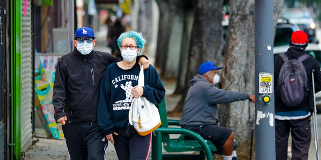 Los Angeles County reinstated a mask mandate last week amid surging COVID-19 cases. (Irfan Khan / Los Angeles Times via Getty Images)