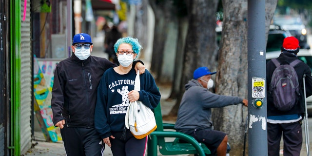 Los Angeles County reinstated a mask mandate last week amid surging COVID-19 cases. (Irfan Khan / Los Angeles Times via Getty Images)
