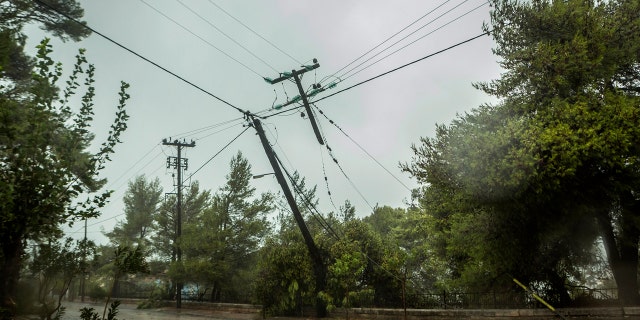 Damaged power and telecommunication lines are seen during a storm at the port of Argostoli, on the Ionian island of Kefalonia, western Greece, Friday, Sept. 18, 2020.