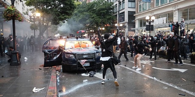 Kelly Thomas Jackson, 20, allegedly threw Molotov cocktails at two Seattle police vehicles during a May 30 protests that devolved into a riot. (Photo: Department of Justice)