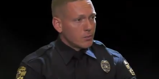 Officer Curtis Neraasen said a bystander helped remove the toddler from the damaged vehicle. (Orlando Police Department)