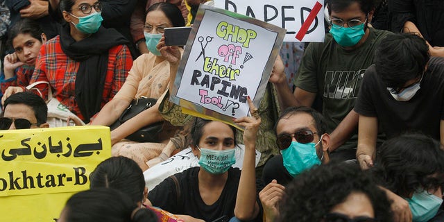 Members of civil society groups take part in a rally to condemn the incident of rape on a deserted highway, in Karachi, Pakistan, Saturday, Sept. 12, 2020. Pakistani police said they detained 15 people for questioning after two armed men allegedly gang-raped a woman in front of her children after her car broke down on a deserted highway near the eastern city of Lahore. (AP Photo/Fareed Khan)