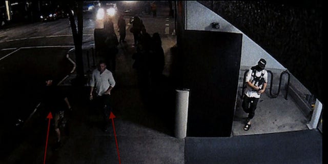 Security footage shows Reinoehl in an alcove of the parking garage while Danielson and a friend walk by, police said. 