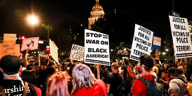 People protest the grand jury decision in the Breonna Taylor case in front of the Colorado Statehouse on Sept. 23, 2020, in Denver. (Getty Images)