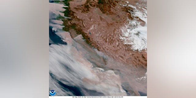 This satellite image provided by the National Oceanic and Atmospheric Administration at 20:36 UTC (1:36 pm PDT) shows smoke from wildfires blown westward, from California's Sierra Nevada to the Coast Ranges, at center to left, and from Oregon at top left, Tuesday, Sept. 8, 2020.