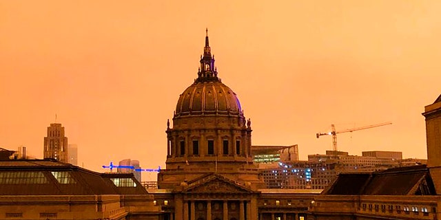 San Francisco City Hall is shrouded in smoke from multiple wildfires burning in the Sierra Nevada and Coast Ranges of Northern California, Wednesday morning, Sept. 9, 2020.