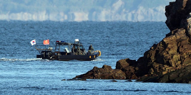 A South Korean marine boat patrols near Yeonpyeong island, South Korea, on Sunday. (Baek Seung-ryul/Yonhap via AP)