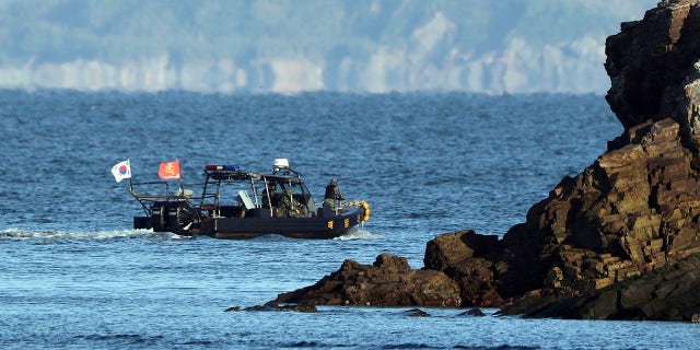 A South Korean marine boat patrols near Yeonpyeong island, South Korea, on Sunday.  (Baek Seung-ryul/Yonhap via AP)