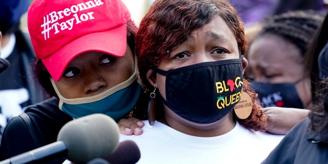 Tamika Palmer, the mother of Breonna Taylor, right, listens to a news conference, Friday, in Louisville, Ky. (AP)