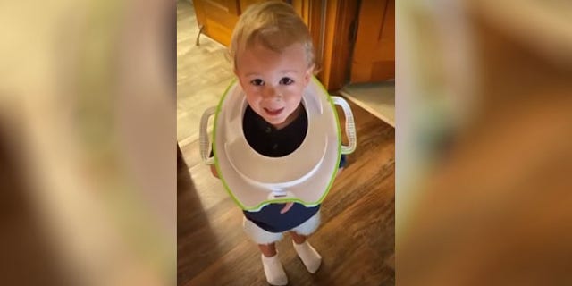 Abbie Paull said she only took her eyes off her son, Reuben, for a few seconds when he somehow got his training toilet stuck around his neck.