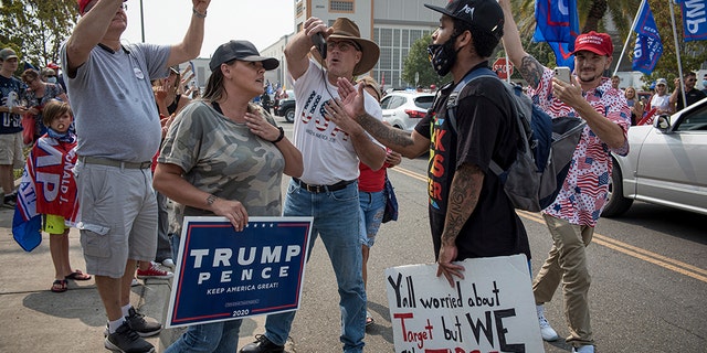 Supporters of U.S. President Donald Trump and a Black Lives Matter demonstrator rally at Sacramento McClellan Airport in Sacramento, California, U.S., on Monday, Sept. 14, 2020. David Paul Morris/Bloomberg via Getty Images