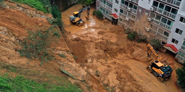 Mud from a landslide hit a parking lot at an apartment in Geoje, South Korea, Monday, Sept. 7, 2020.