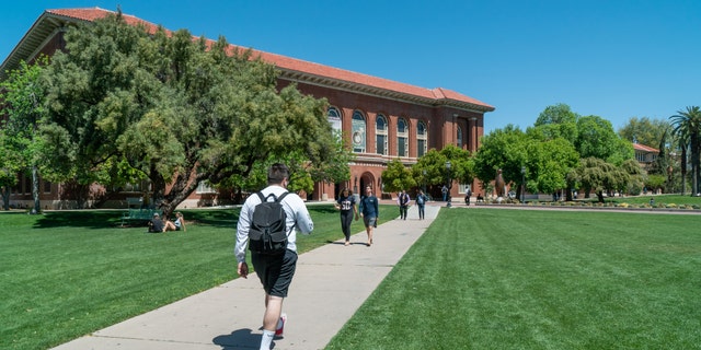 TUCSON, AZ/USA - APRIL 11, 2019: Unidentified Individuals on the campus lawn of the University of Arizona.