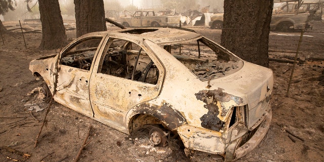 Flames from the Beachie Creek Fire melted the aluminum rims on a car near the destroyed Oregon Department of Forestry, North Cascade District Office in Lyons, Ore., Sunday, Sept. 13, 2020.