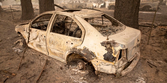 Flames from the Beachie Creek Fire melted the aluminum rims on a car near the destroyed Oregon Department of Forestry, North Cascade District Office in Lyons, Ore., Sunday, Sept. 13, 2020.